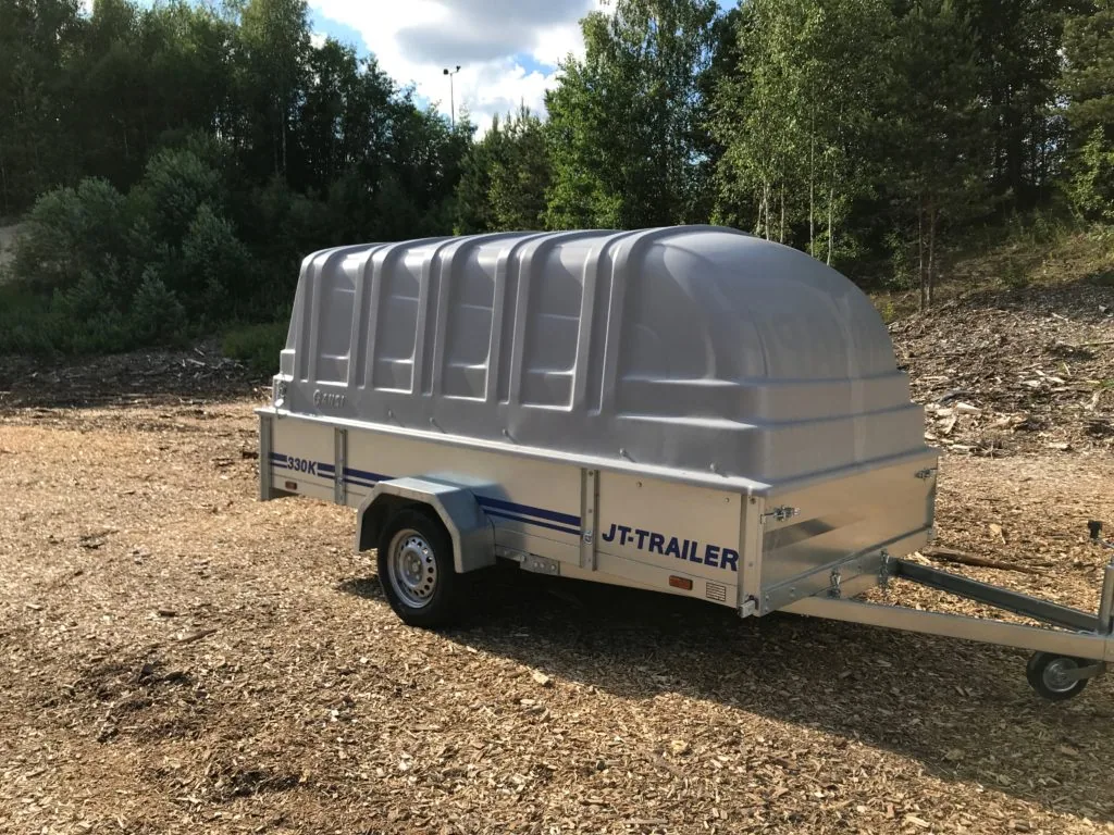 JT-Trailer 330K covered trailer in a wooded yard