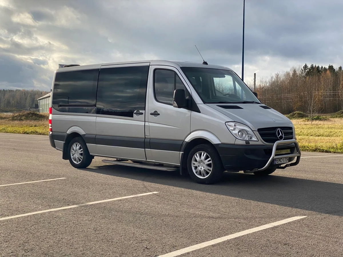 Silver Mercedes-Benz Sprinter minibus