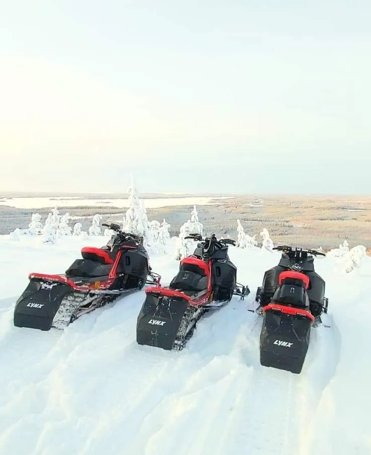 Snowmobiles in a snowy landscape, illustrative photo